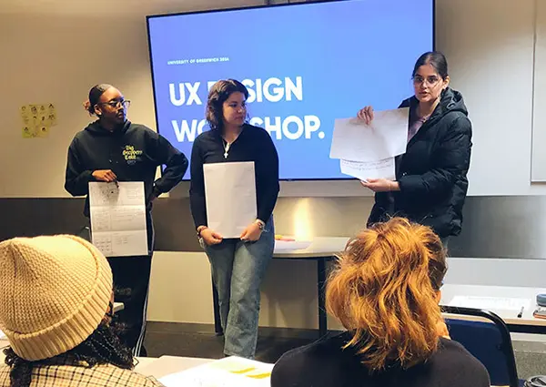 my two classmates and I pitching our idea to the class